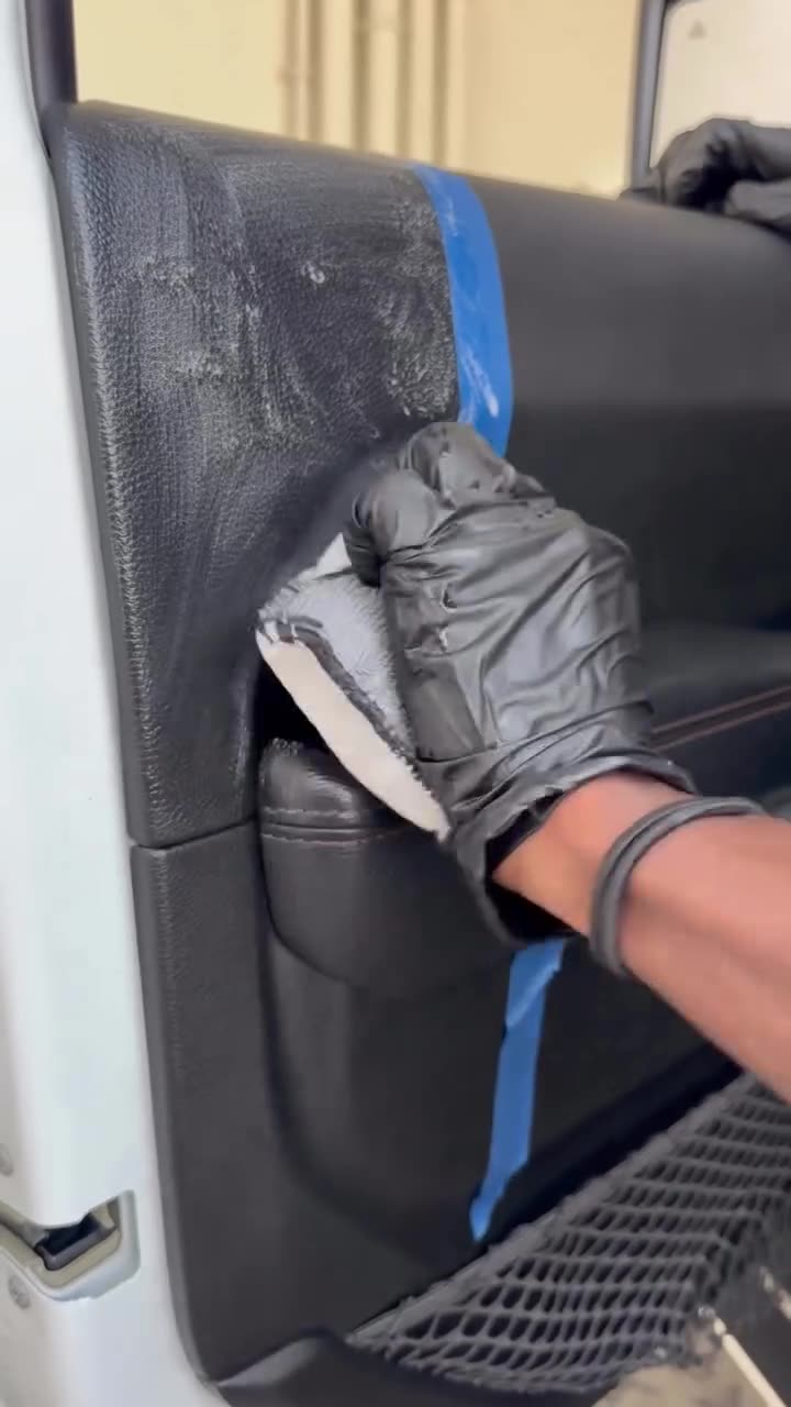Jeep door panel being deep-cleaned by hand